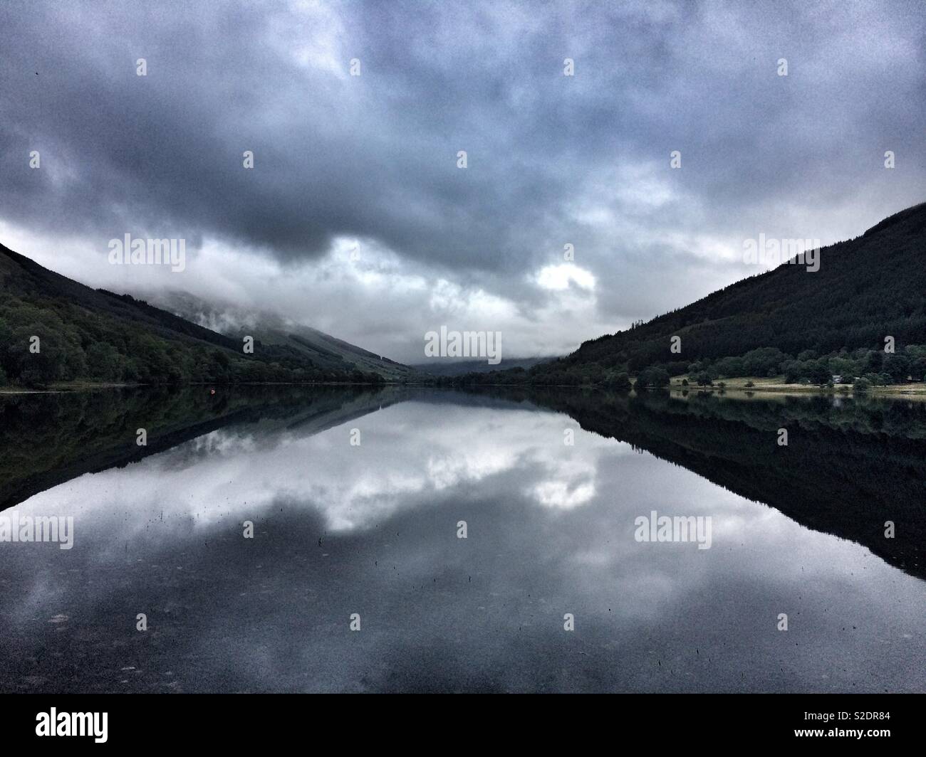 A dramatic cloudy daybreak on the banks of Loch Voil, in the Trossachs, Scotland. - Smartphone Captured Stock Image