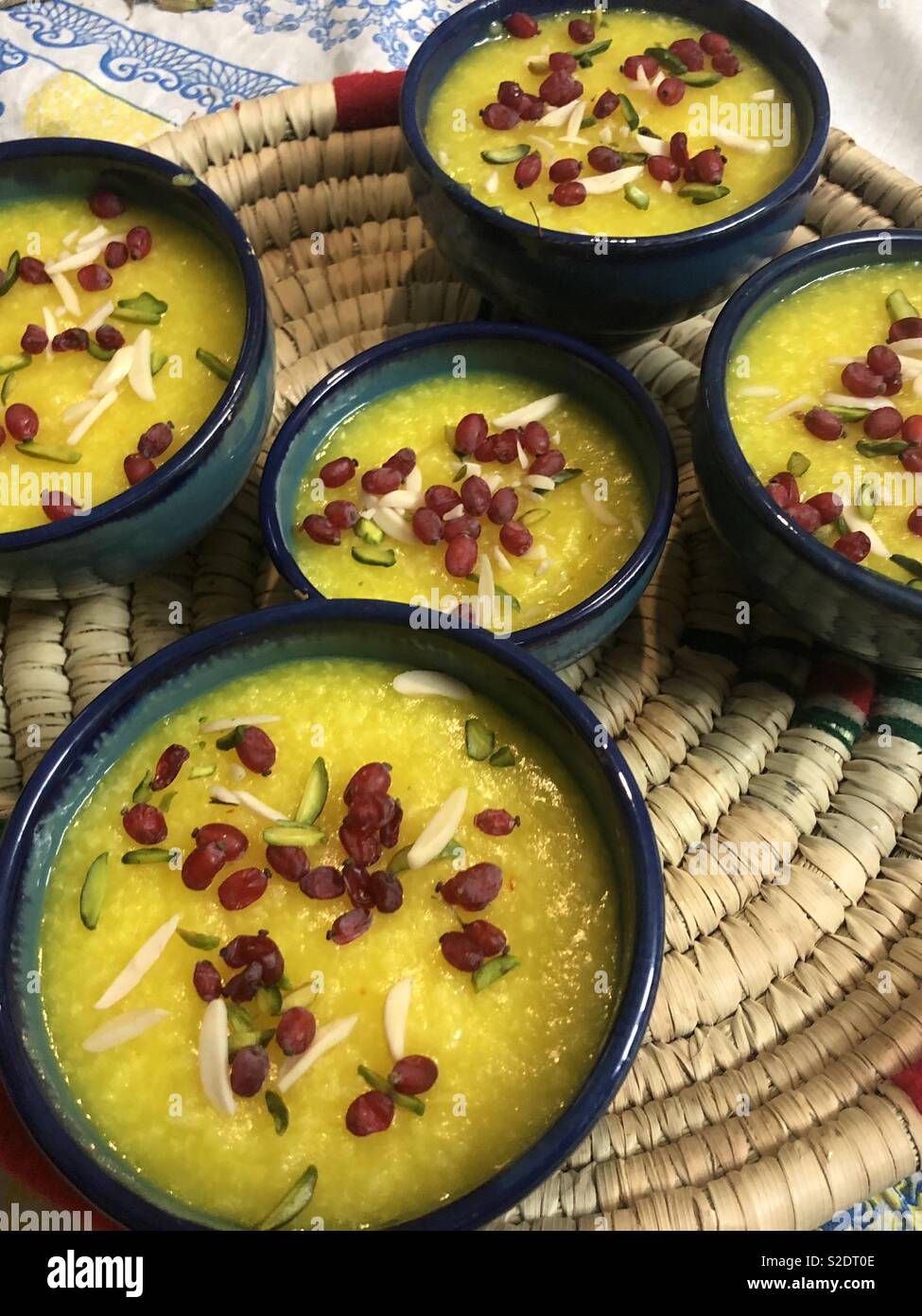 Colorful iranian saffron dessert made with rice, saffron, almonds