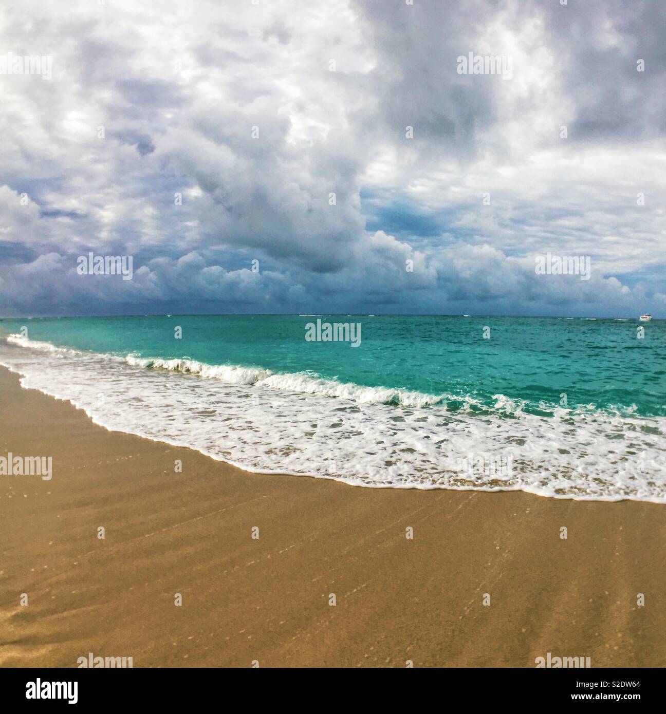 Tropical turquoise seascape under dramatic clouds. Square crop. - Smartphone Captured Stock Image
