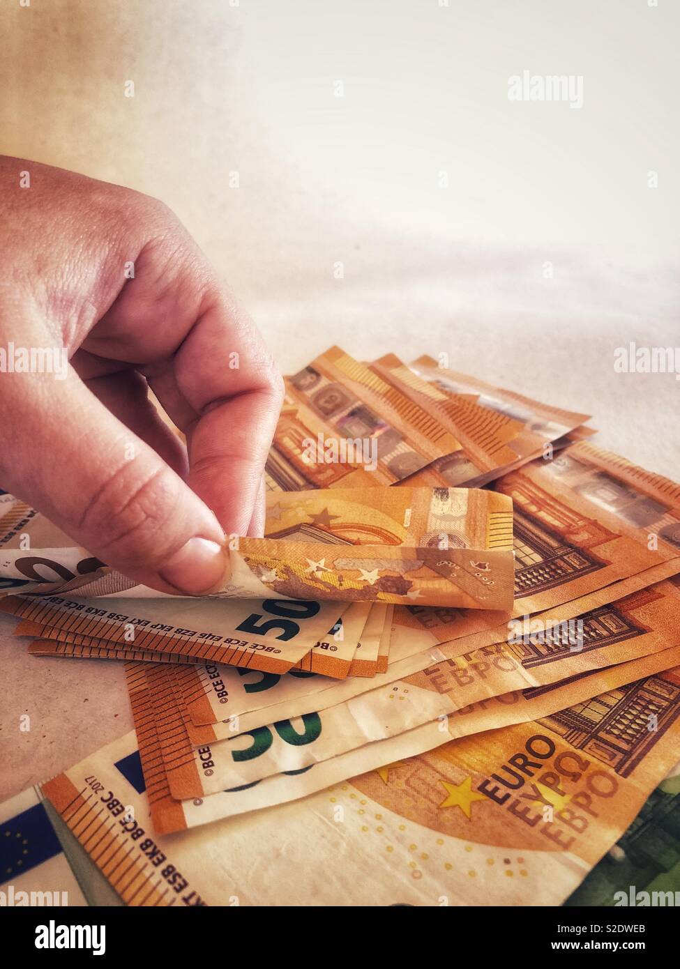 Counting a pile of Euro banknotes - Smartphone Captured Stock Image
