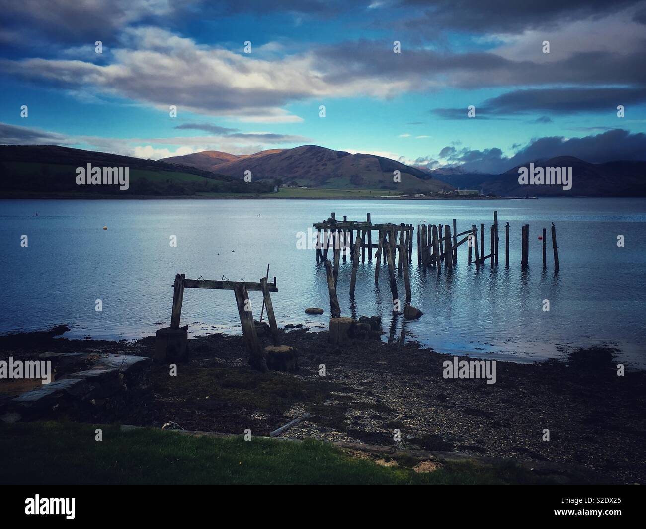 The old, ruined wooden pier Port Bannatyne, Isle of Bute Stock Photo