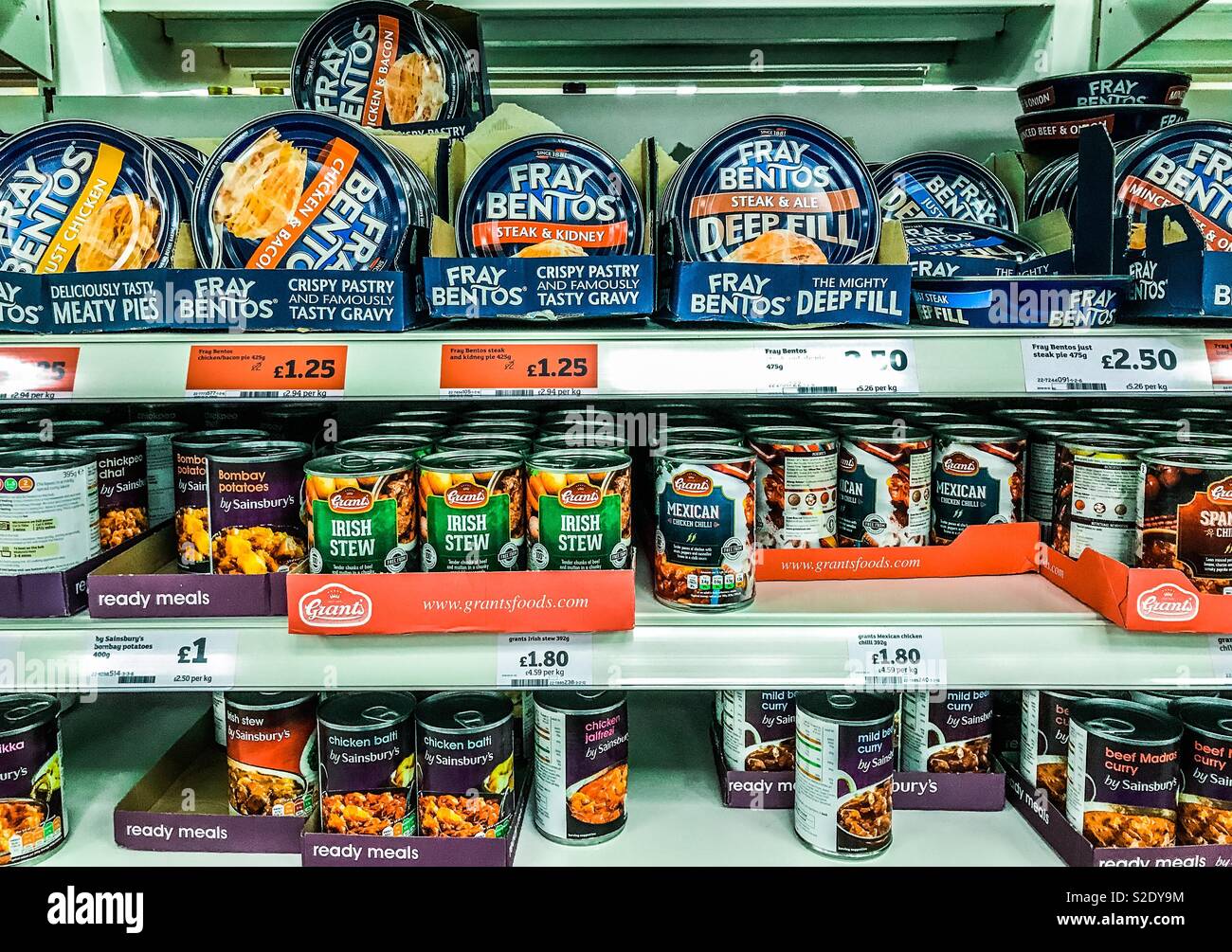 Fray Bentos pies and tinned food for sale on supermarket shelves Stock Photo