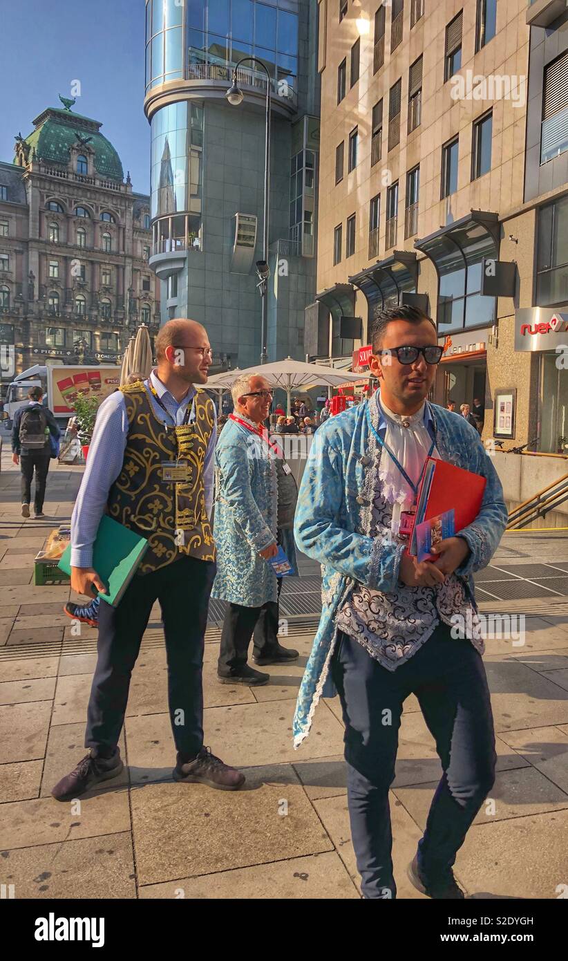 Men dressed in costume to sell theatre tickets in Vienna, Austria. - Smartphone Captured Stock Image