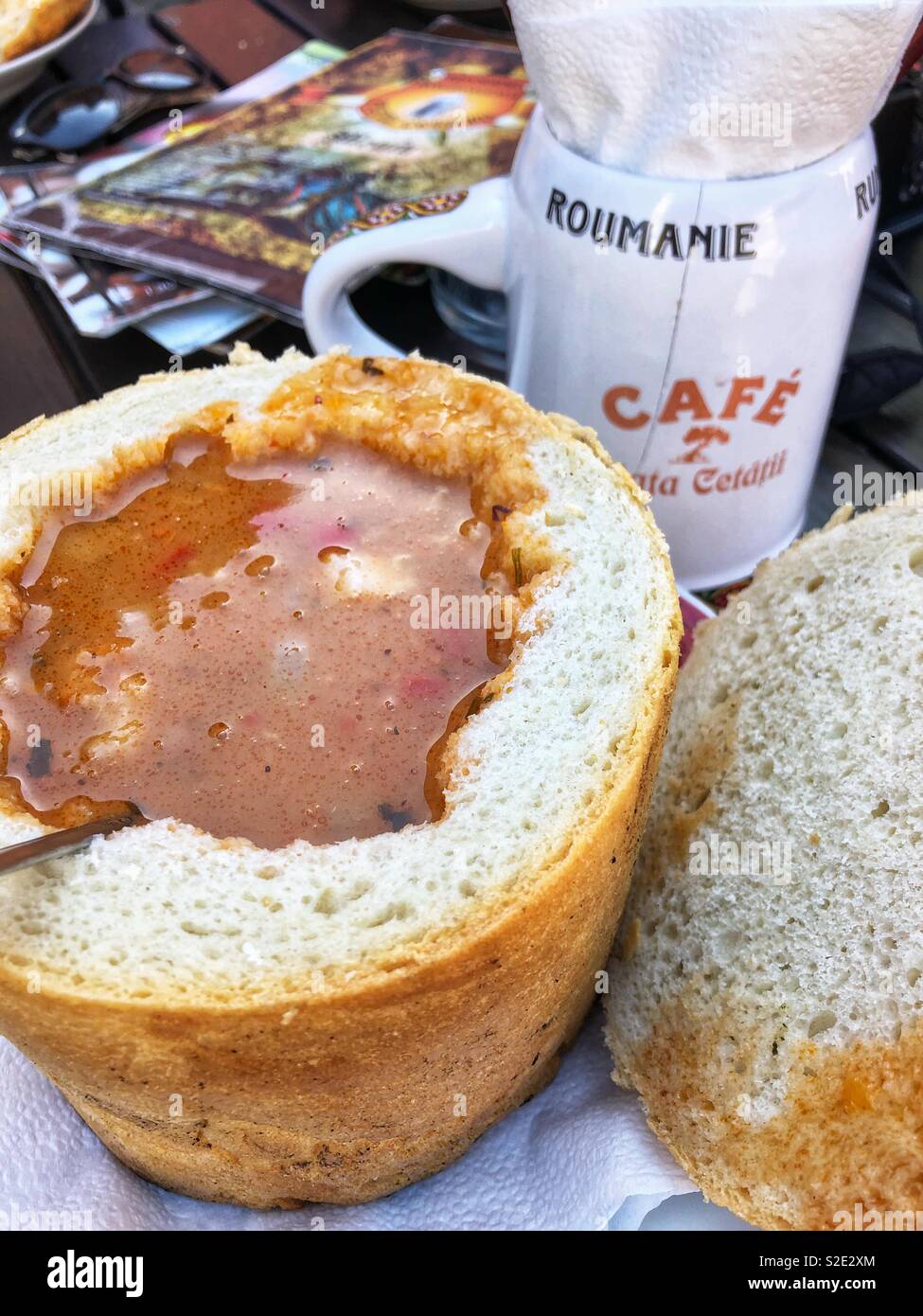 Traditional Romanian bean soup served in bread. - Smartphone Captured Stock Image