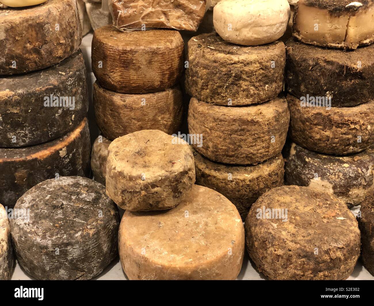 Different types of cheese at the open space market - Smartphone Captured Stock Image