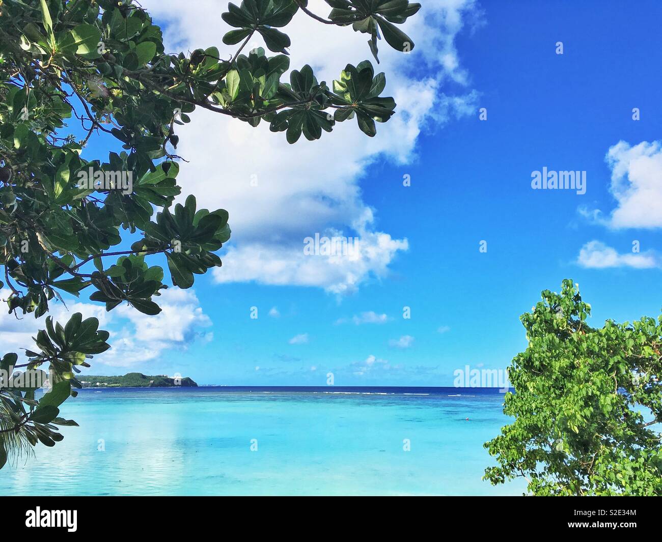 Tumon Bay Beach in Tamuning, Guam. Territory of United States in Micronesia in the western Pacific Ocean. - Smartphone Captured Stock Image