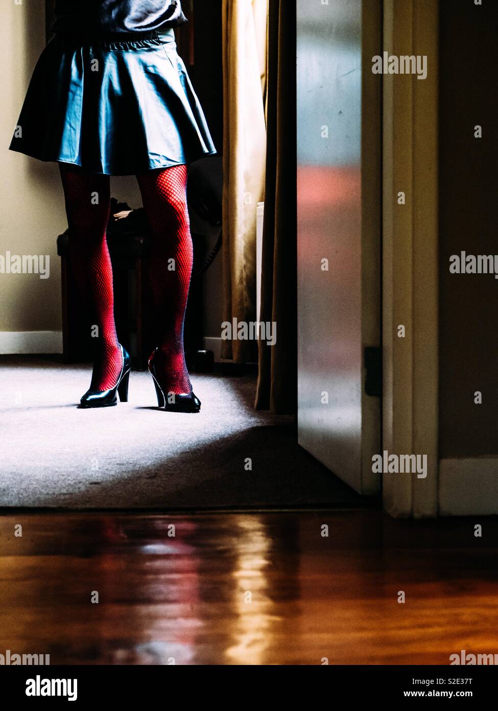 Woman standing in the doorway - Smartphone Captured Stock Image