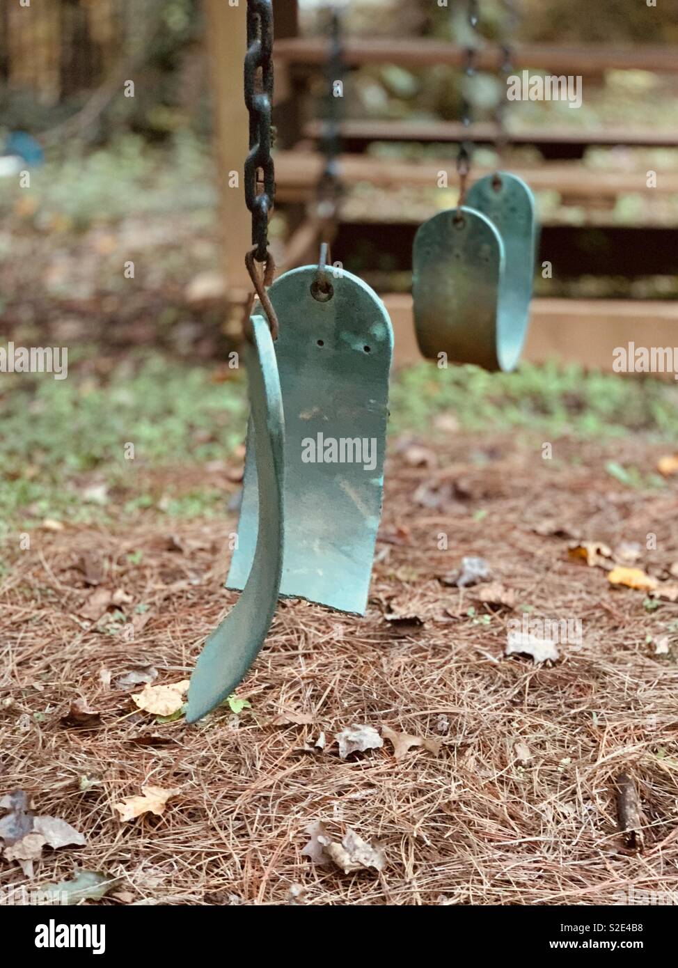 Broken swing set on playground Stock Photo Alamy