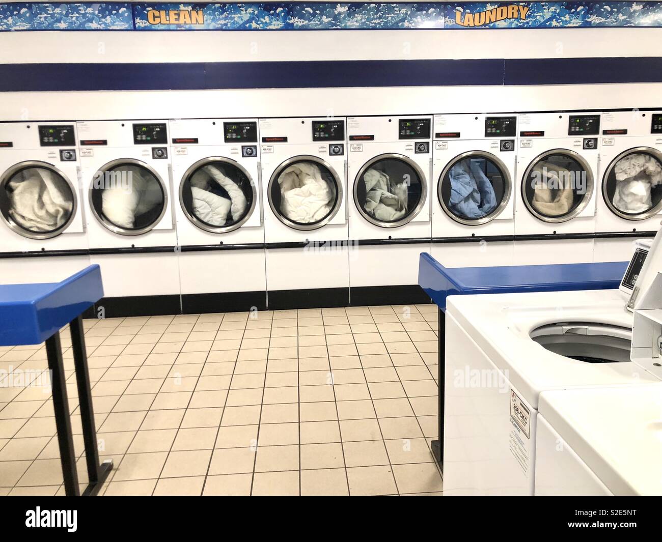 Laundry day at the laundromat Stock Photo Alamy
