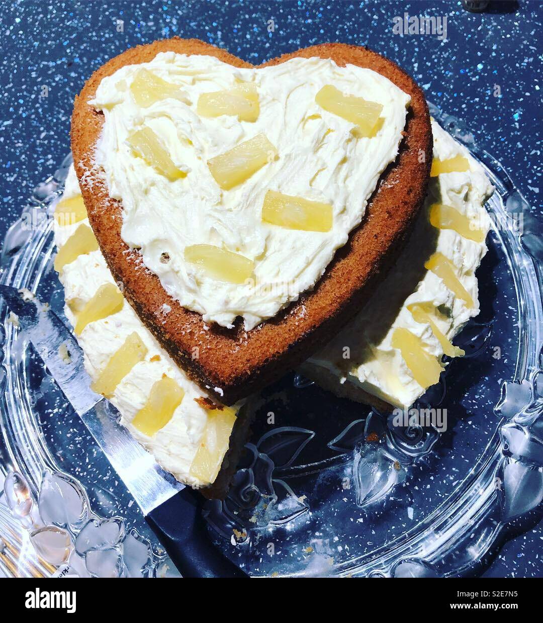 Pineapple heart cake with a piece missing - Smartphone Captured Stock Image