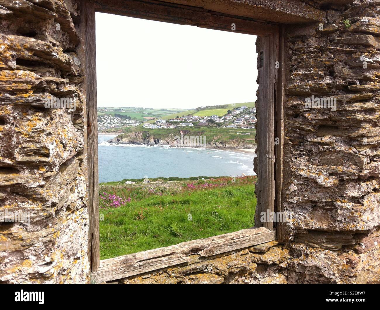 Burgh Island through window of ruins on coast at Plymouth seaside Stock Photo