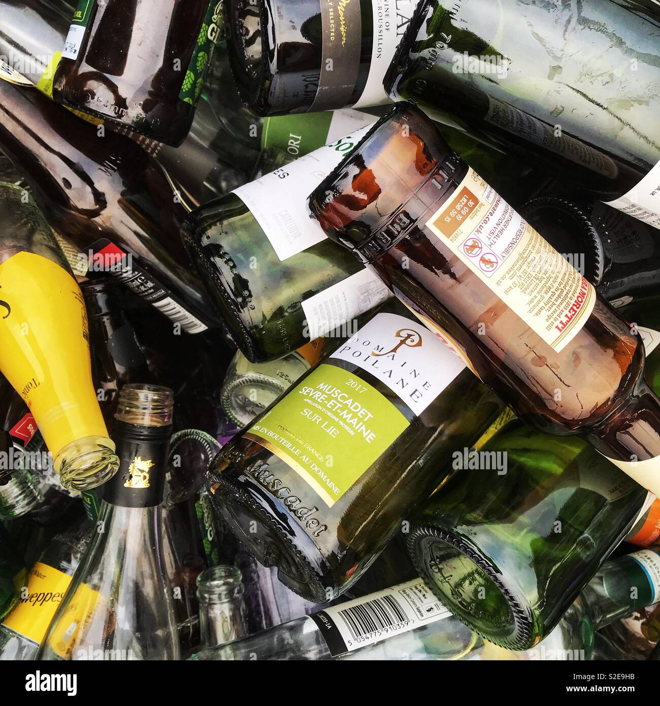 Glass recycling bottle bank full of bottles in UK Stock Photo Alamy