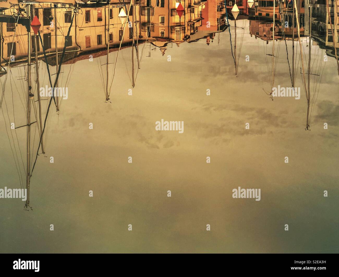 Reflections of buildings and sailboats on the water - Grado, Italy - Smartphone Captured Stock Image