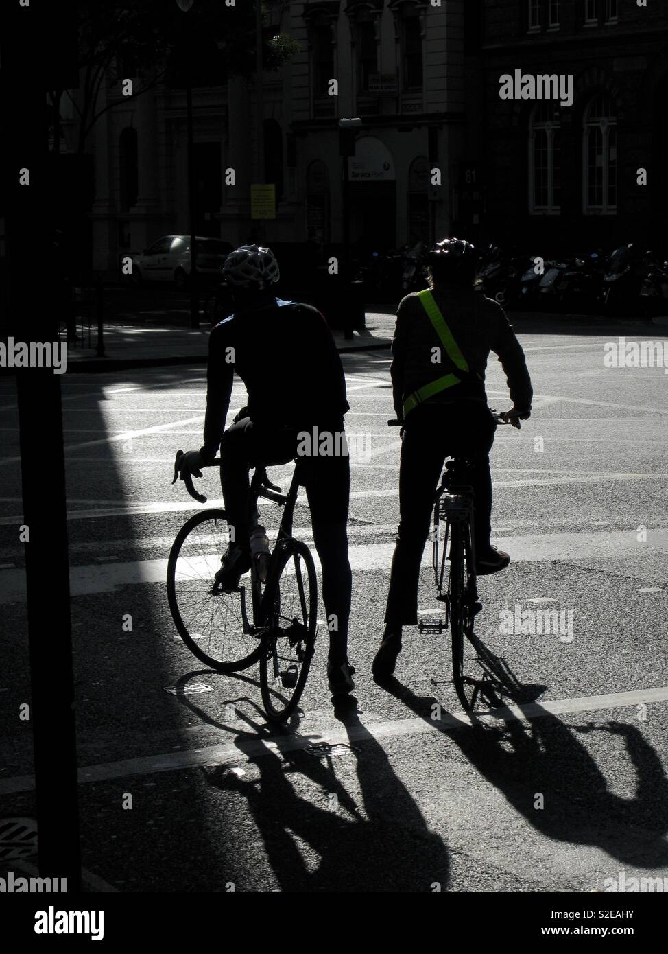 Two cyclists traffic hi-res stock photography and images - Alamy