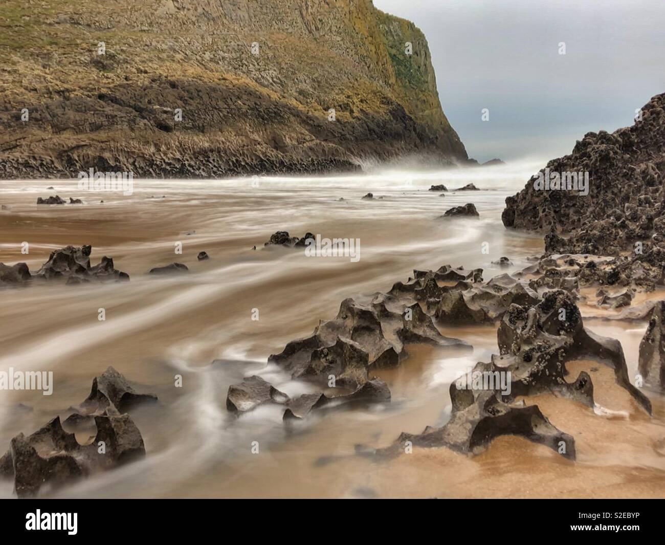 Mewslade beach, Gower, Wales, incoming morning tide, November. - Smartphone Captured Stock Image