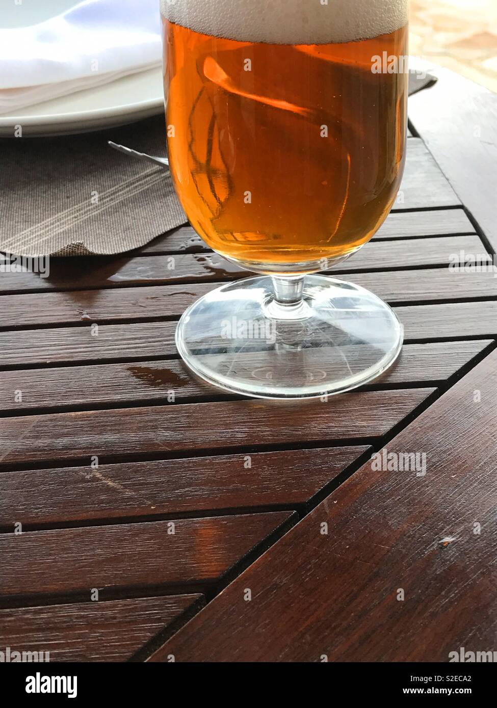 Glass of beer on wooden table. - Smartphone Captured Stock Image