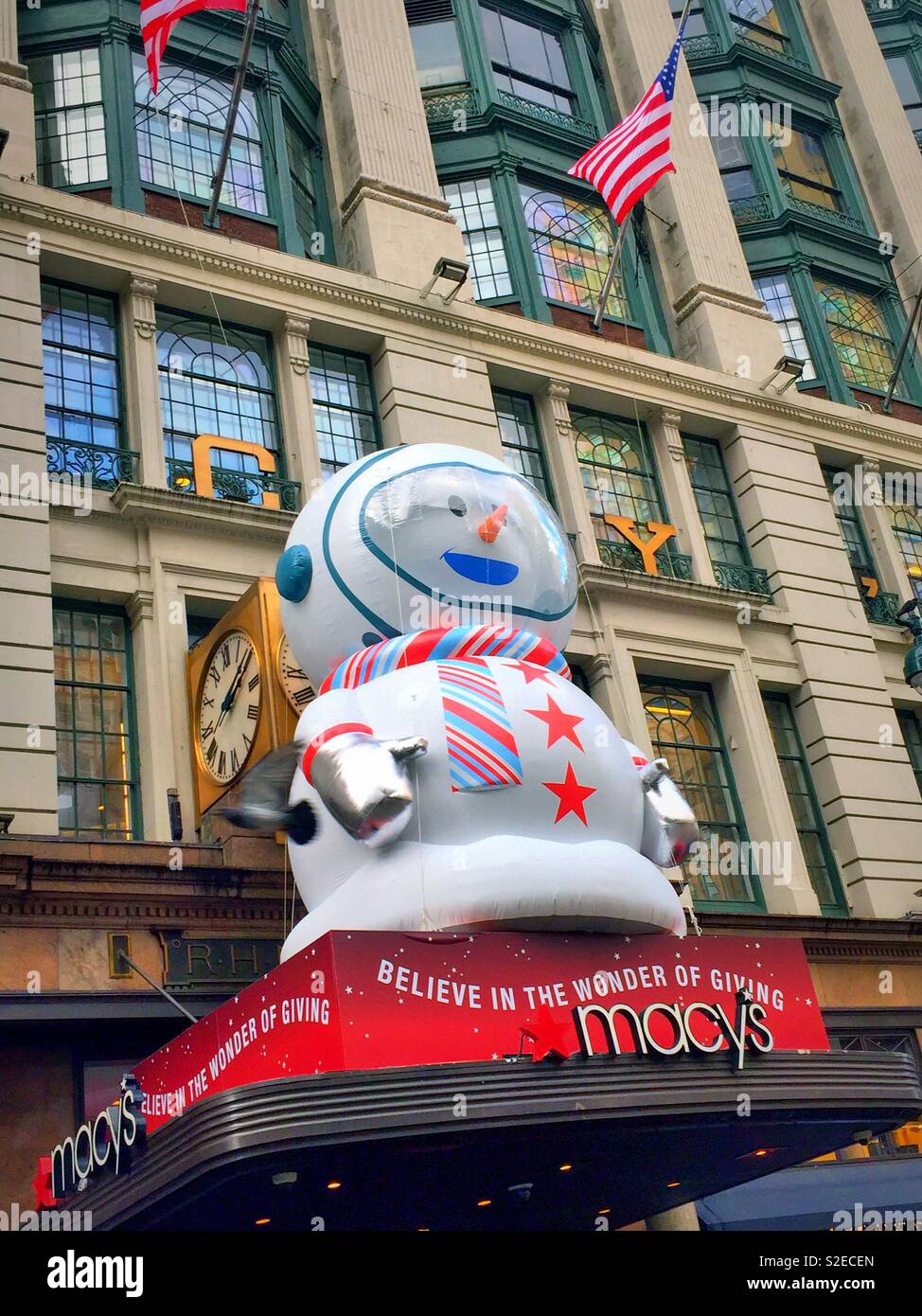 Harold Square entrance to Macy’s featuring Sunny the snowpal inflated balloon, NYC, - Smartphone Captured Stock Image