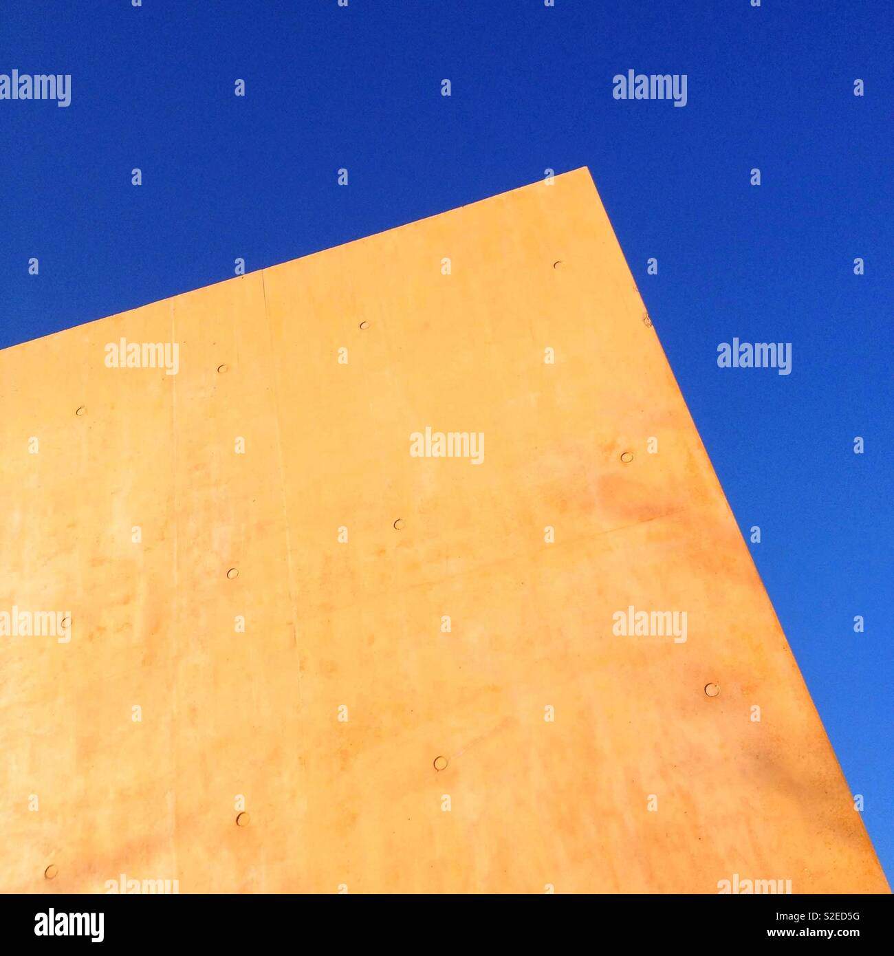 Tinted concrete wall and blue sky - Smartphone Captured Stock Image