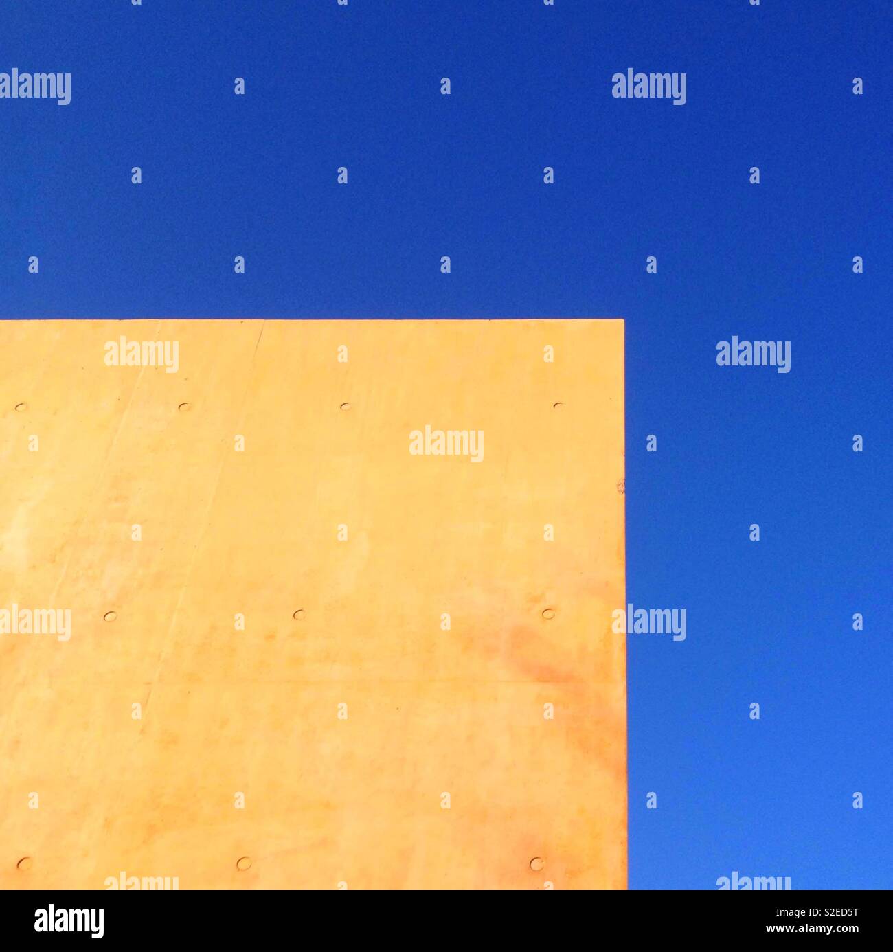 Tinted concrete wall and blue sky - Smartphone Captured Stock Image