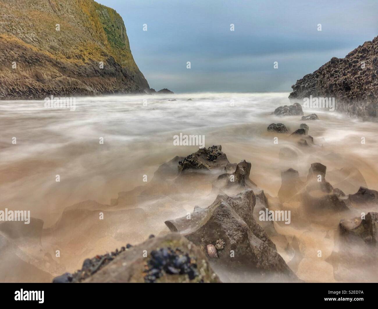 Mewslade beach, Gower, Wales, incoming morning tide, November. - Smartphone Captured Stock Image