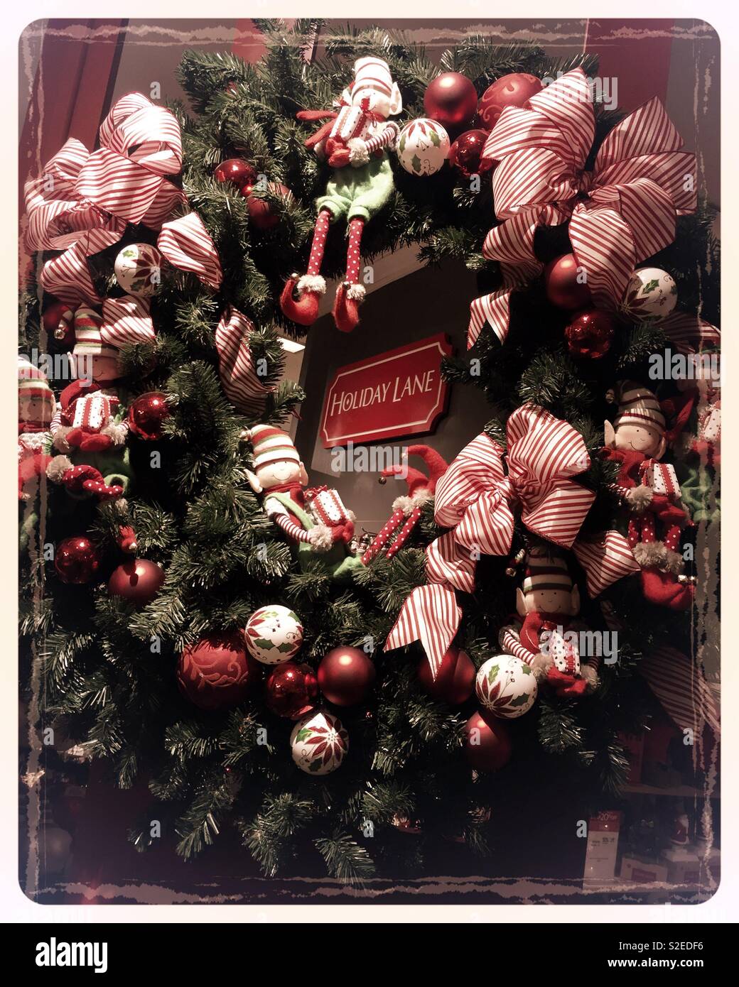 Decorative holiday wreath for sale at Macy’s, NYC, USAA - Smartphone Captured Stock Image