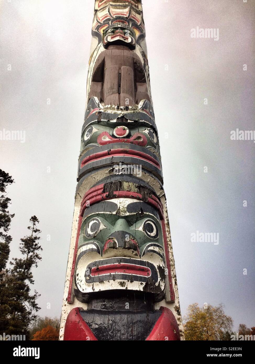 Detail of the Totem Pole at Windsor Great Park, UK.  The Totem Pole was a gift from the people of Canada to HM The Queen in June, 1958. It is 100 feet high. - Smartphone Captured Stock Image