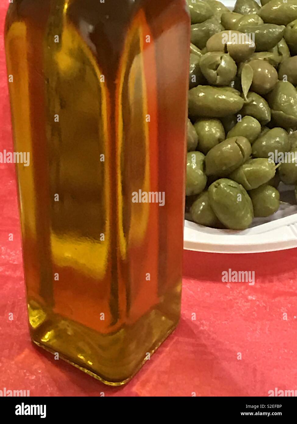 Olive oil and green olives. - Smartphone Captured Stock Image