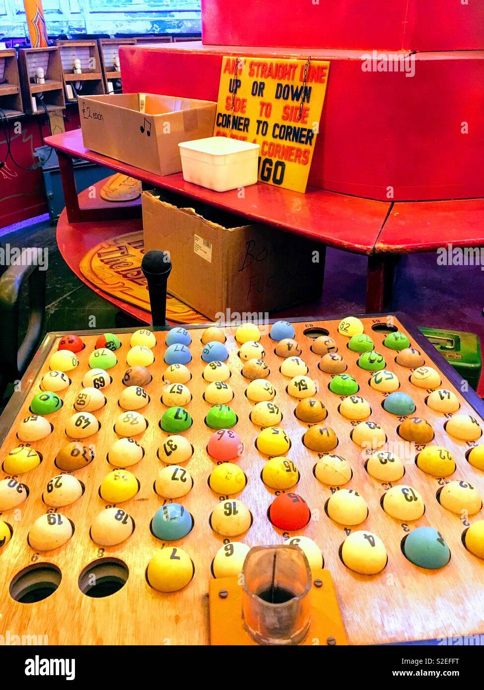 Bingo balls caller’s desk vintage fairground stall at Dingles Fairground Heritage Centre Stock Photo