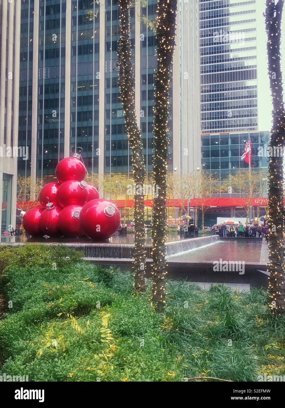 Giant Christmas tree ornament display on Avenue of the Americas during the holiday season, New York City, United States Stock Photo