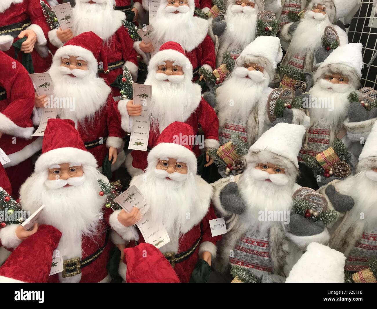 Santa dolls line up on sale for Christmas Stock Photo Alamy