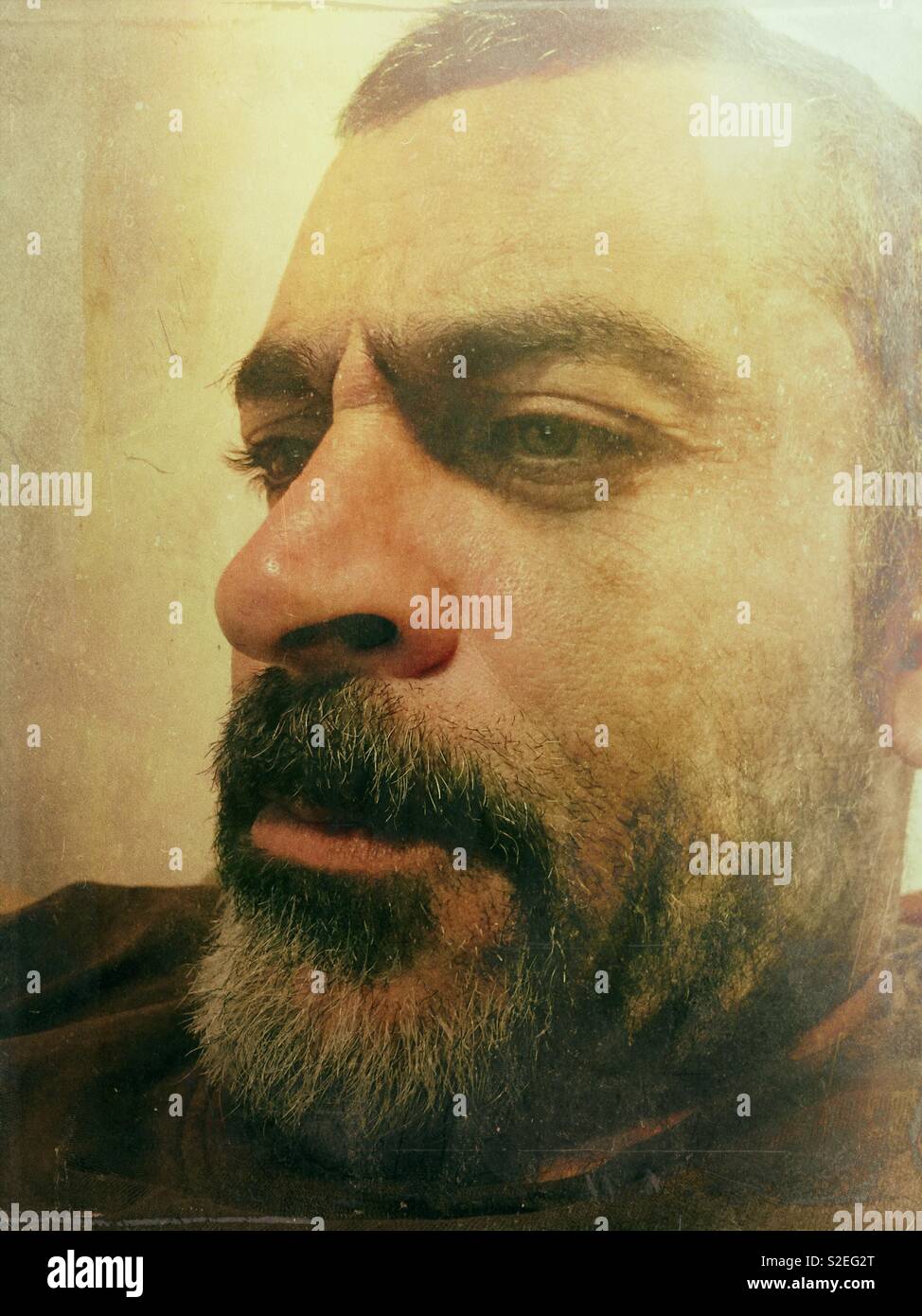 Close up of a Middle Eastern man looking away - Smartphone Captured Stock Image