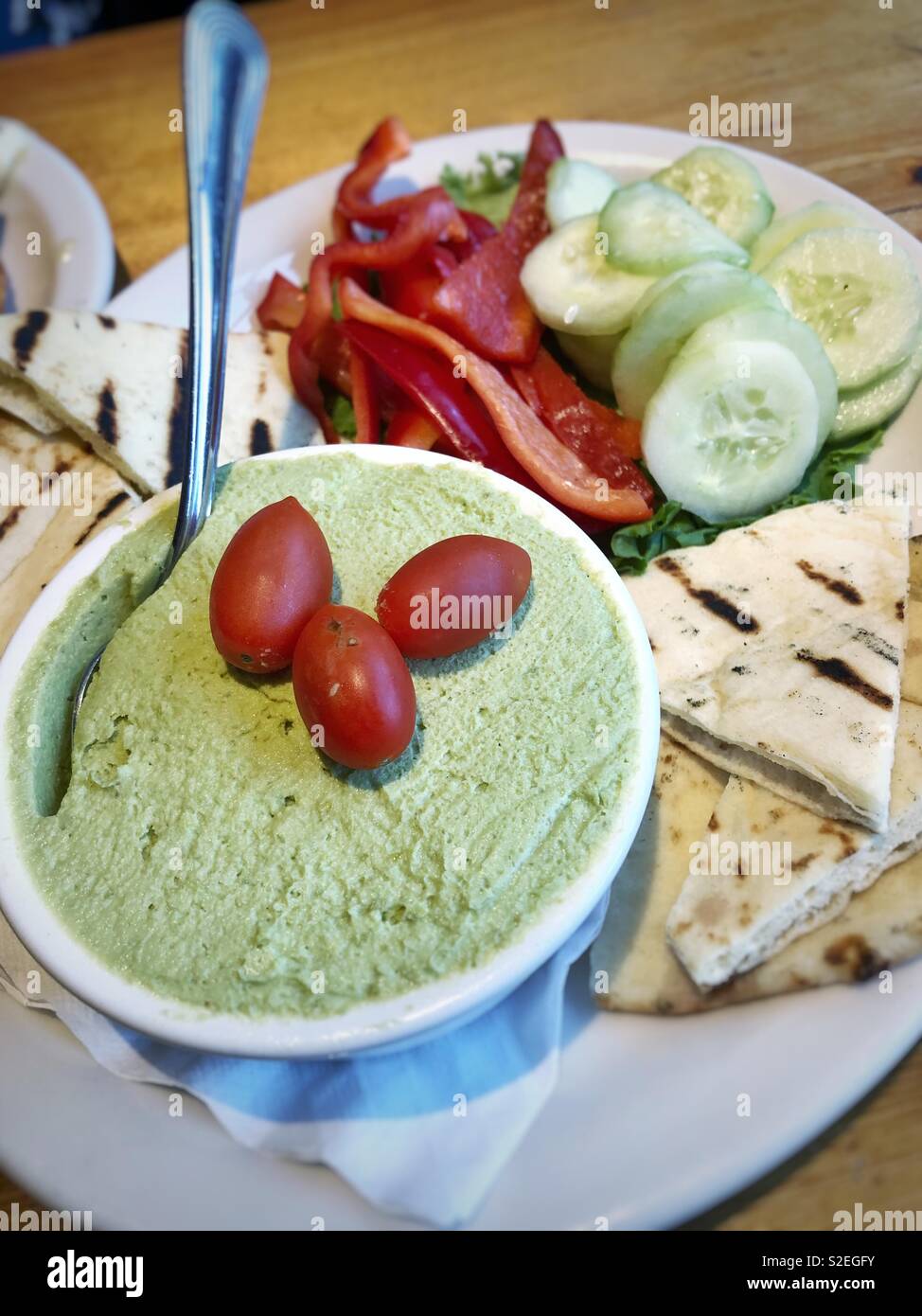Fancy vegan edamame hummus plate with veggies Stock Photo