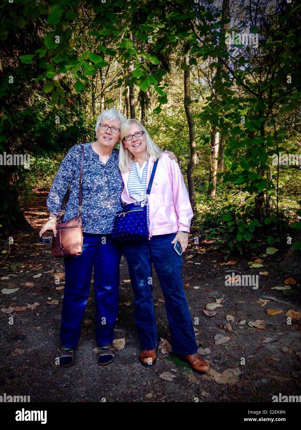 Sister love in a Seattle park Stock Photo
