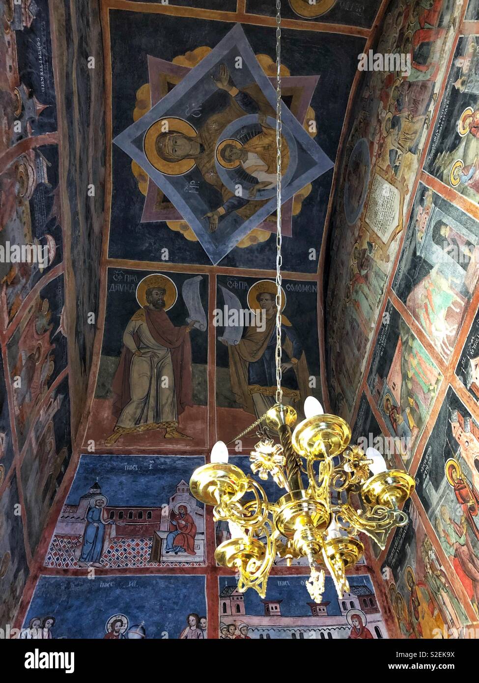 The ornate church interior of the Sinaia Monastery in Romania. - Smartphone Captured Stock Image
