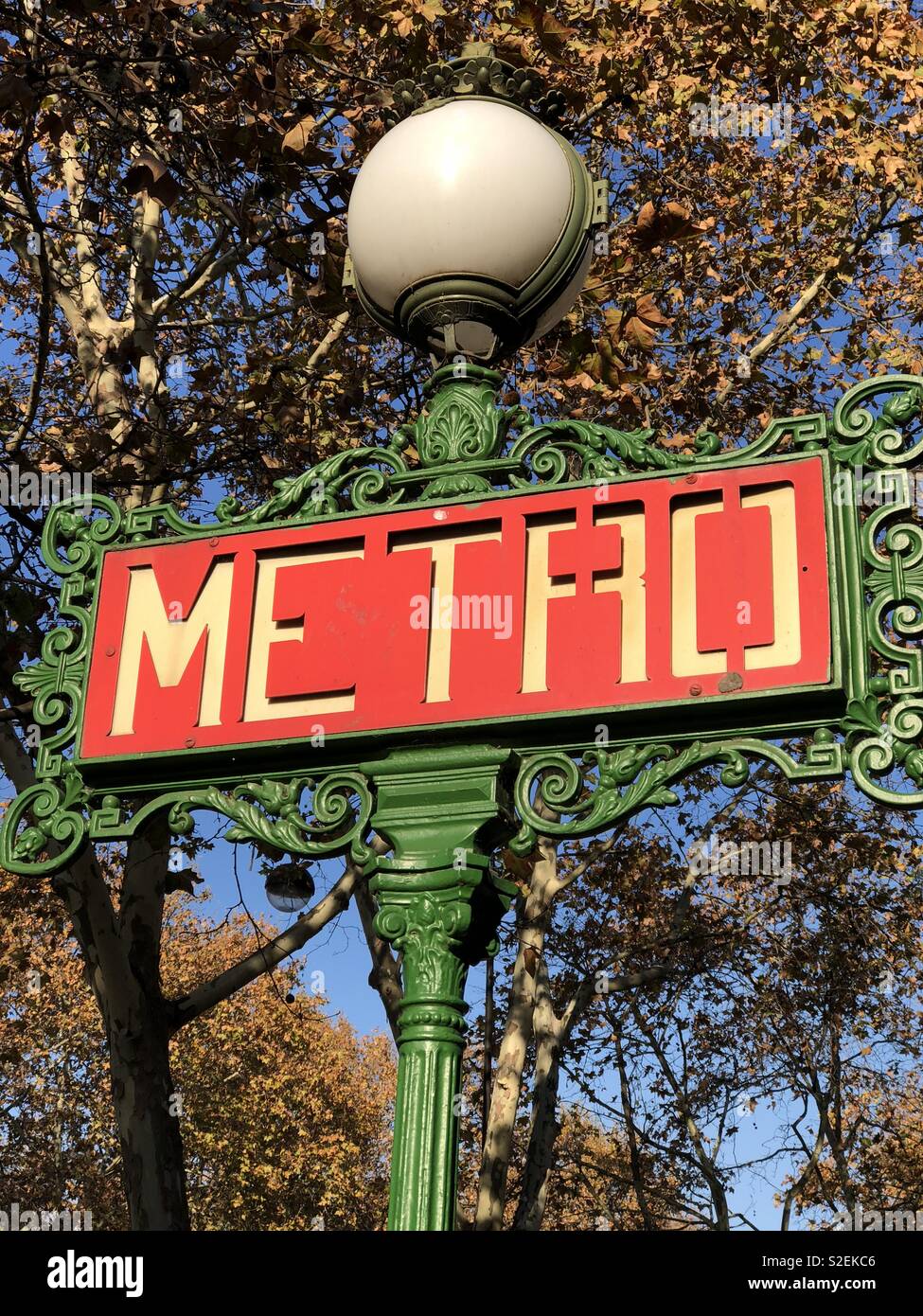 Bright sunlight on a Paris Metro station sign. Stock Photo