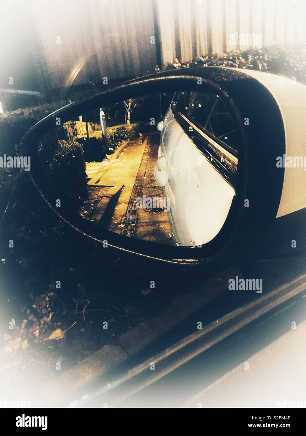 Night reflections in car wing mirror - Smartphone Captured Stock Image