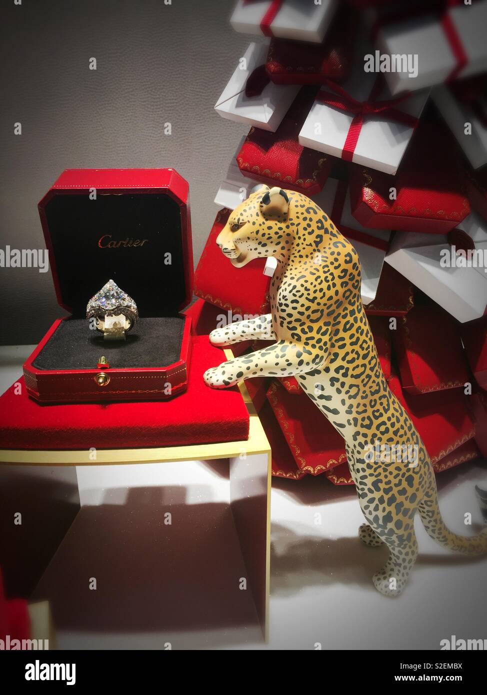 The holiday windows at Cartier’s  feature miniature leopards and jewelry, NYC, USA - Smartphone Captured Stock Image