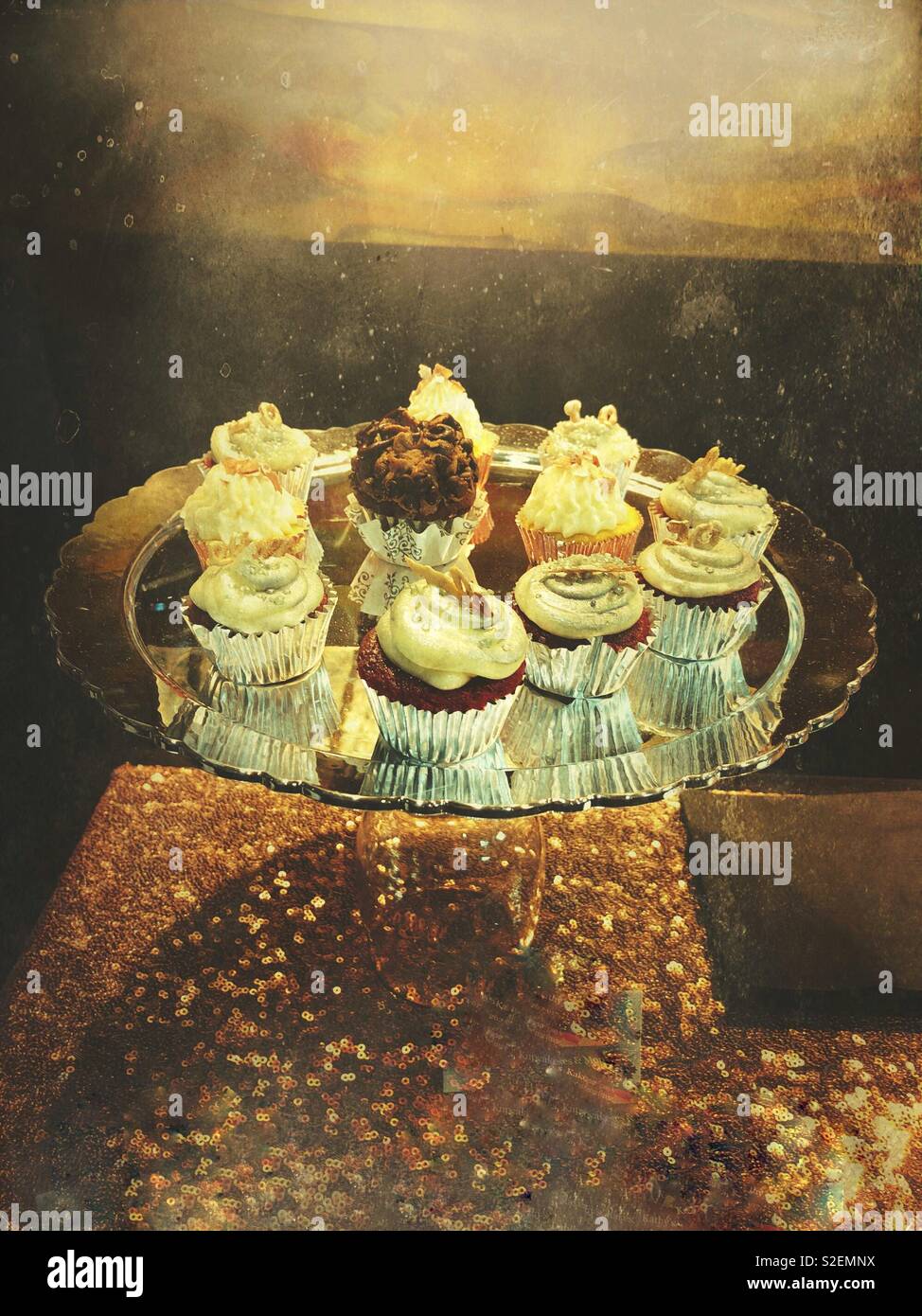 Cupcakes on a sparkling table. Stock Photo