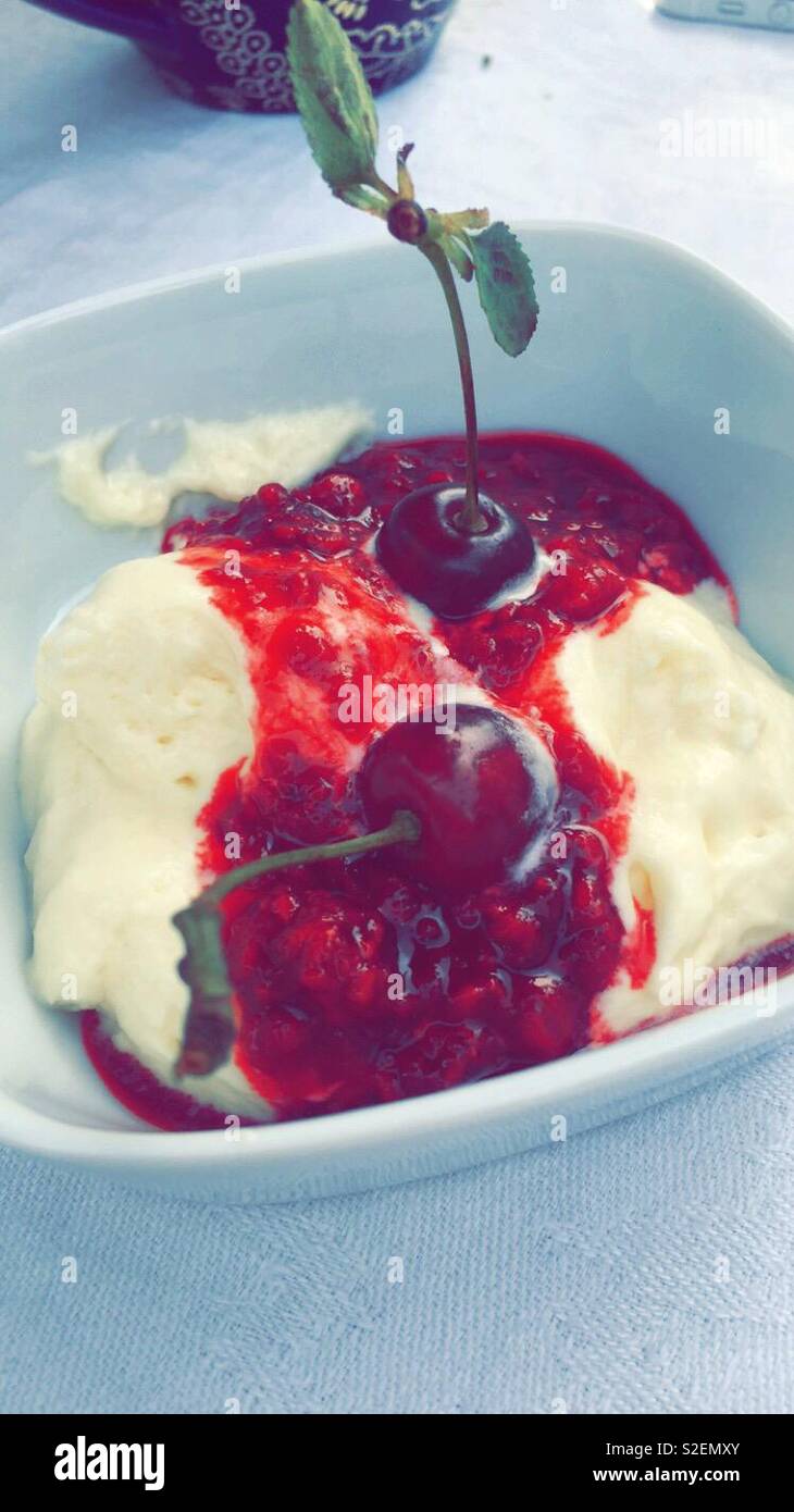 Ice cream with homemade cherry jam Stock Photo