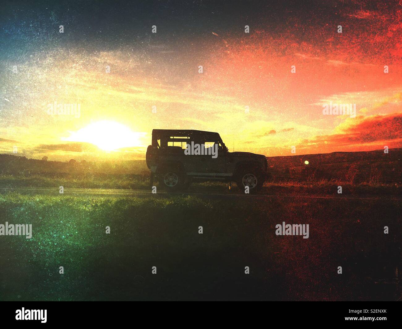 Silhouette of a truck driving at sunset - Smartphone Captured Stock Image