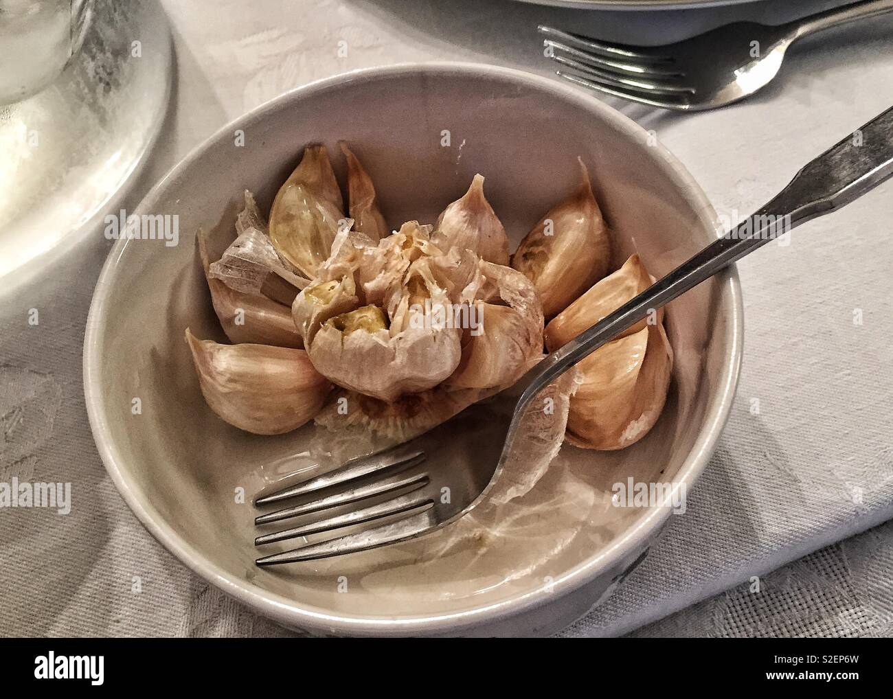 Roasted garlic cloves Stock Photo Alamy