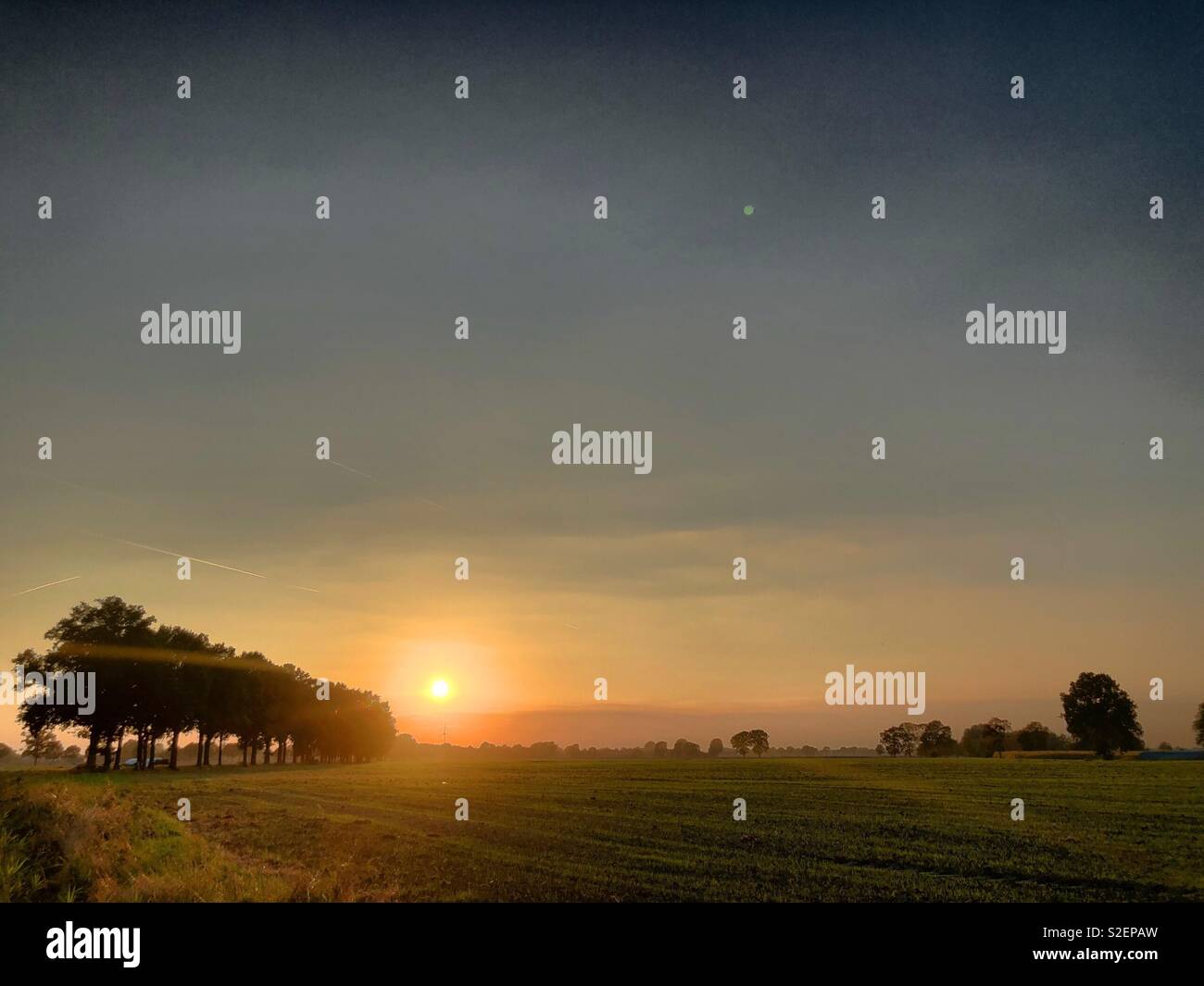 Beautiful idyllic Countryside sunrise landscape taken during the Golden hour in the summer - Smartphone Captured Stock Image