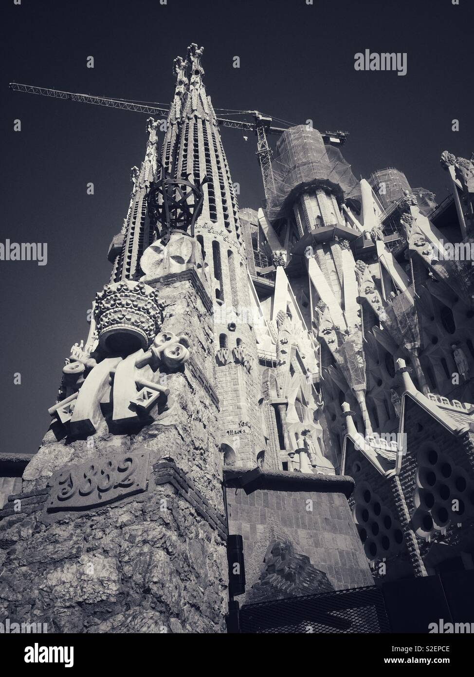 La Sagrada Familia basilica in black and white portrait showing architectural details on the building in Barcelona Spain Stock Photo