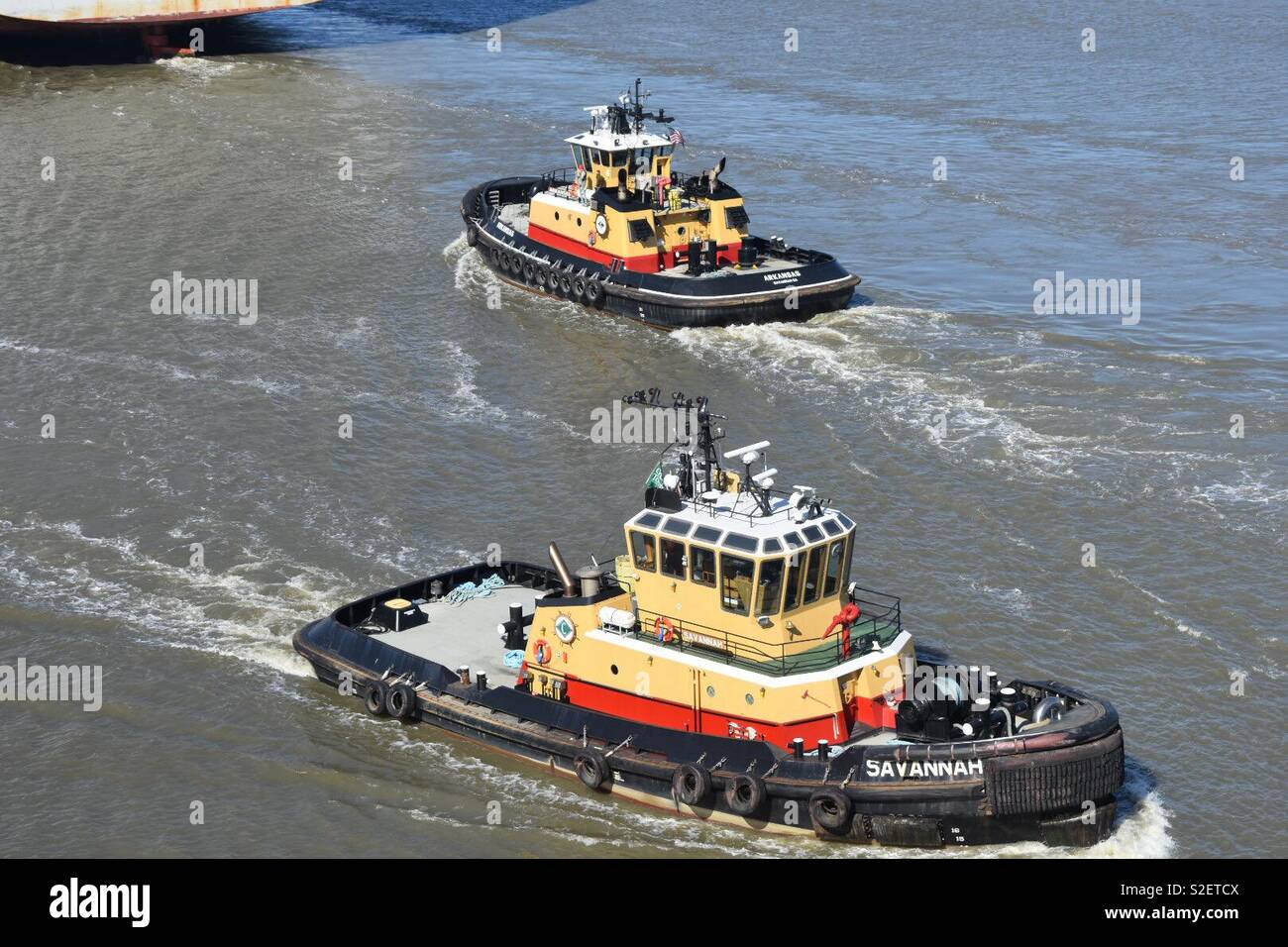 Two tug boats passing on the Savannah River - Smartphone Captured Stock Image