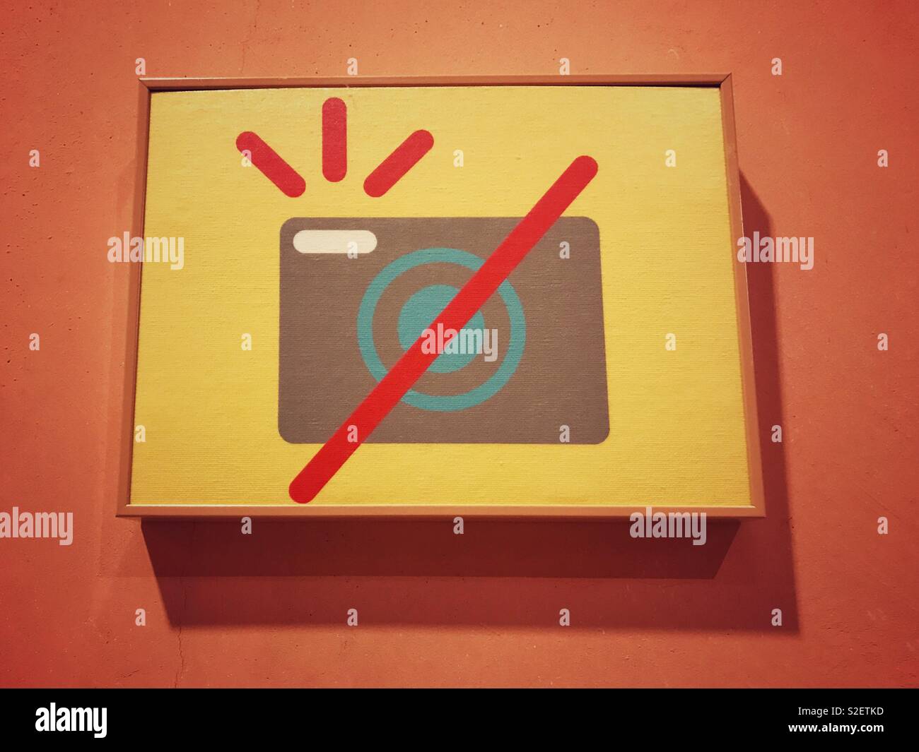 NO FLASH PHOTOGRAPHY! A sign in a Museum requests visitors to turn their camera flashes off if they are going to do any photography. Photo Credit - © COLIN HOSKINS. - Smartphone Captured Stock Image