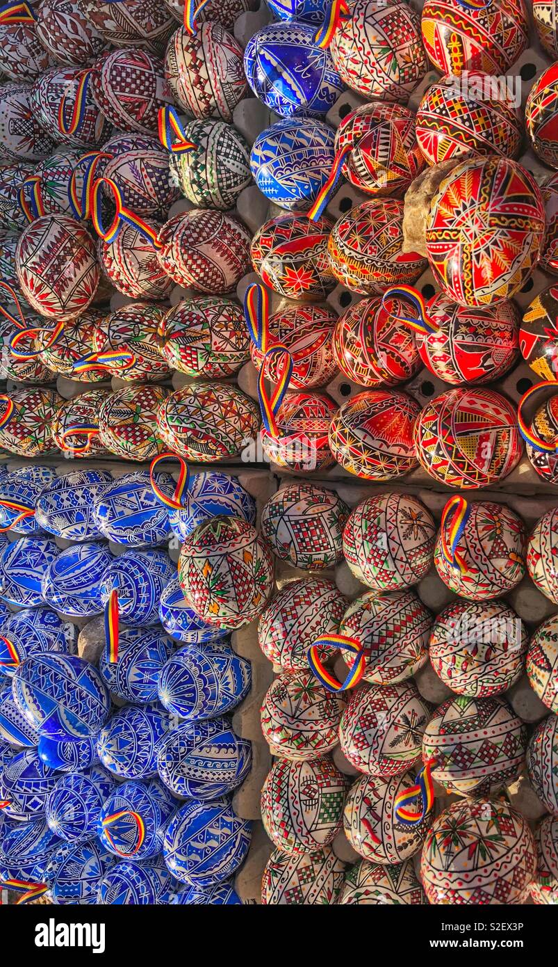 A display of painted wooden eggs. - Smartphone Captured Stock Image