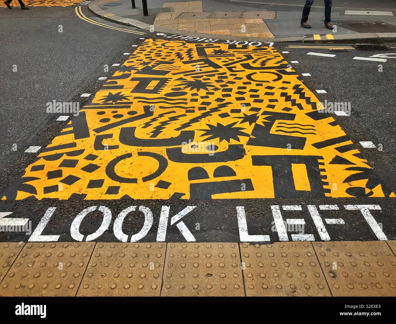 LOOK LEFT! Helpful advice to pedestrians who need to cross a busy road in the Barbican area of London, England. Photo © COLIN HOSKINS. - Smartphone Captured Stock Image