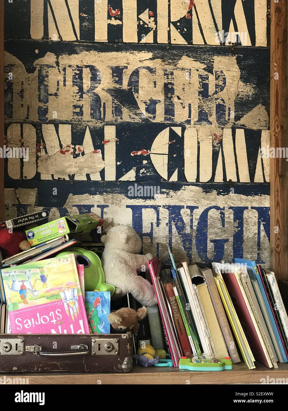 Books on shelf with white wall hires stock photography and images Alamy