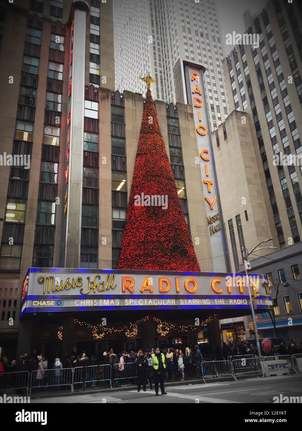 Radio city Music hall holiday decorations and main entrance on Avenue of the Americas, New York City, United States - Smartphone Captured Stock Image