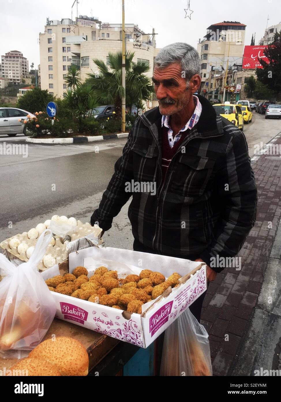 A Palestinian man selling falafel in the streets of Beit Lechem. Stock Photo